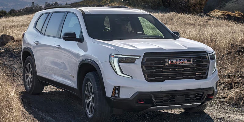 2025 GMC Acadia driving on dirt road